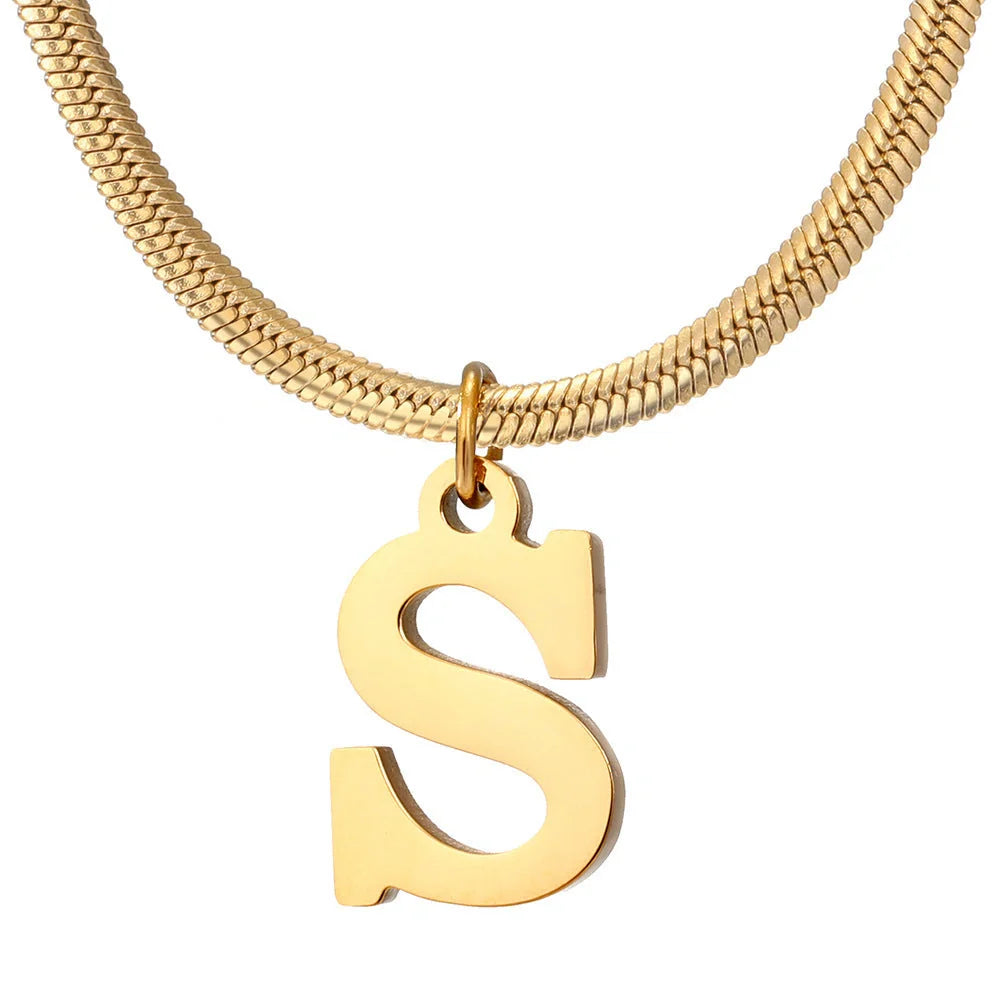 Elegant gold A-Z letter pendant necklace on a snake chain