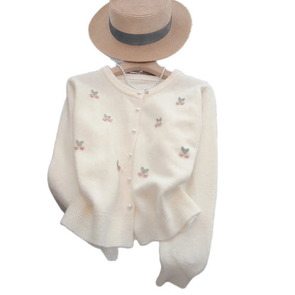 Pink women's slim fit cashmere cardigan coat with beaded details on a round neck.