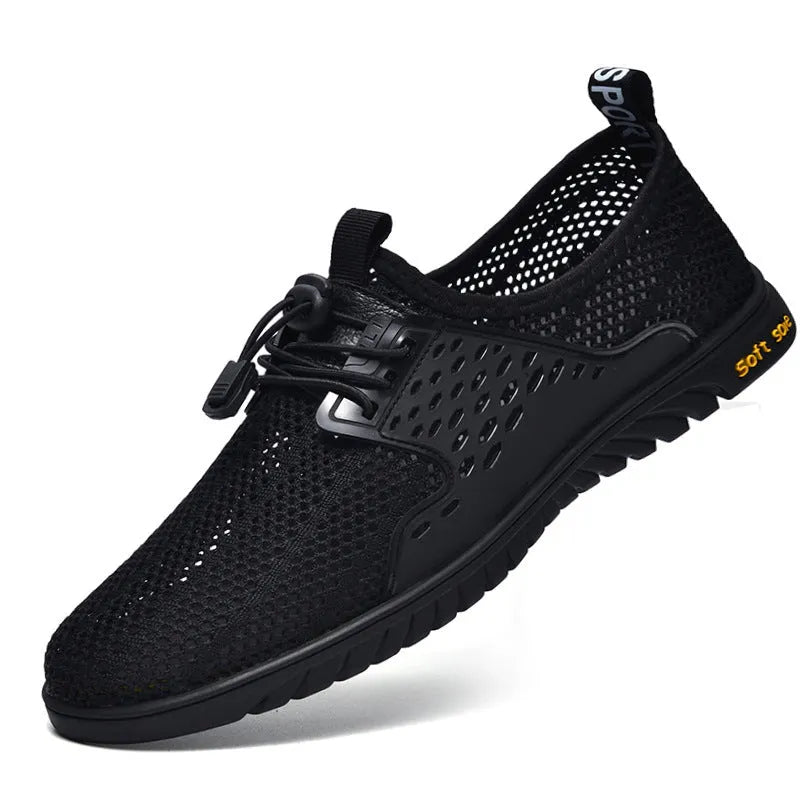 Men's breathable casual mesh summer shoes in black grey sand colour with elastic band closure and rubber sole available in sizes 37 to 47 for universal sports and leisure use as a lightweight low heel round toe design