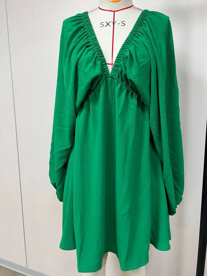 Women's apricot V-neck dress with long puff sleeves and a flounced swing skirt.