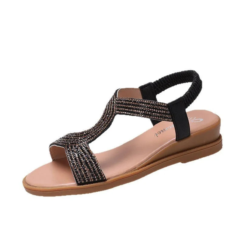 Women's summer beach sandals with non-slip sole in lightweight patent leather PU with rhinestone decoration, available in gold, silver, and black colours and sizes 35-42 with round toe holder shape