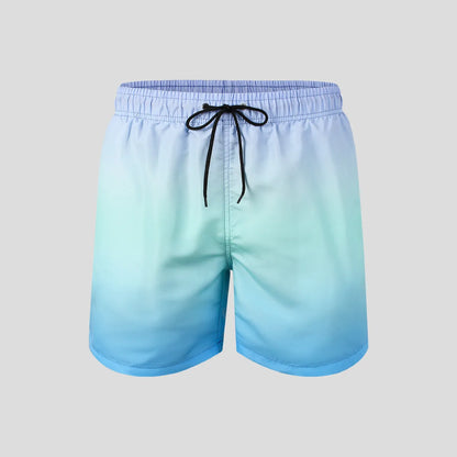 Men's grey gradient print sports shorts made from breathable mesh fabric, shown on a model.