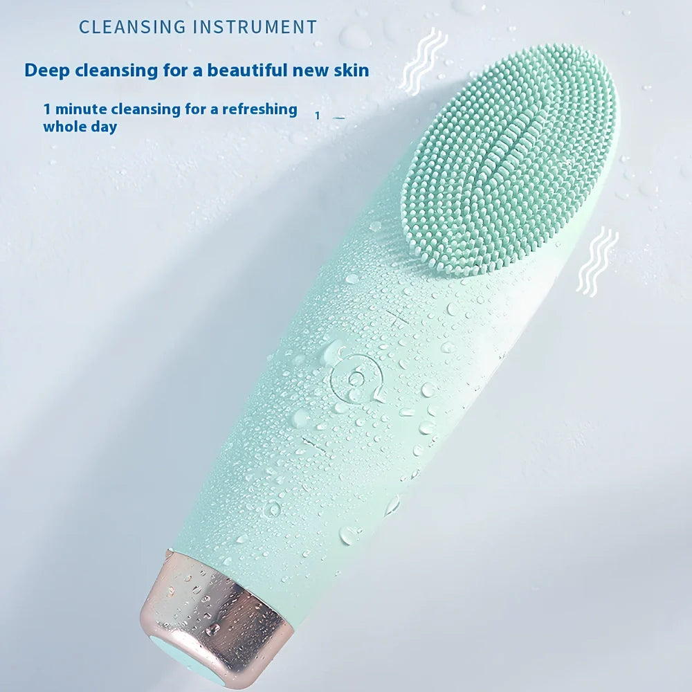 Green electric facial cleaner with silicone brush head, measuring 15cm length