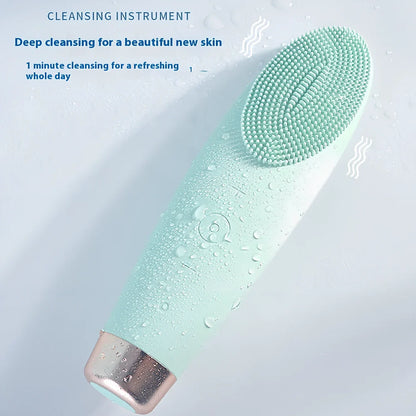 Green electric facial cleaner with silicone brush head, measuring 15cm length