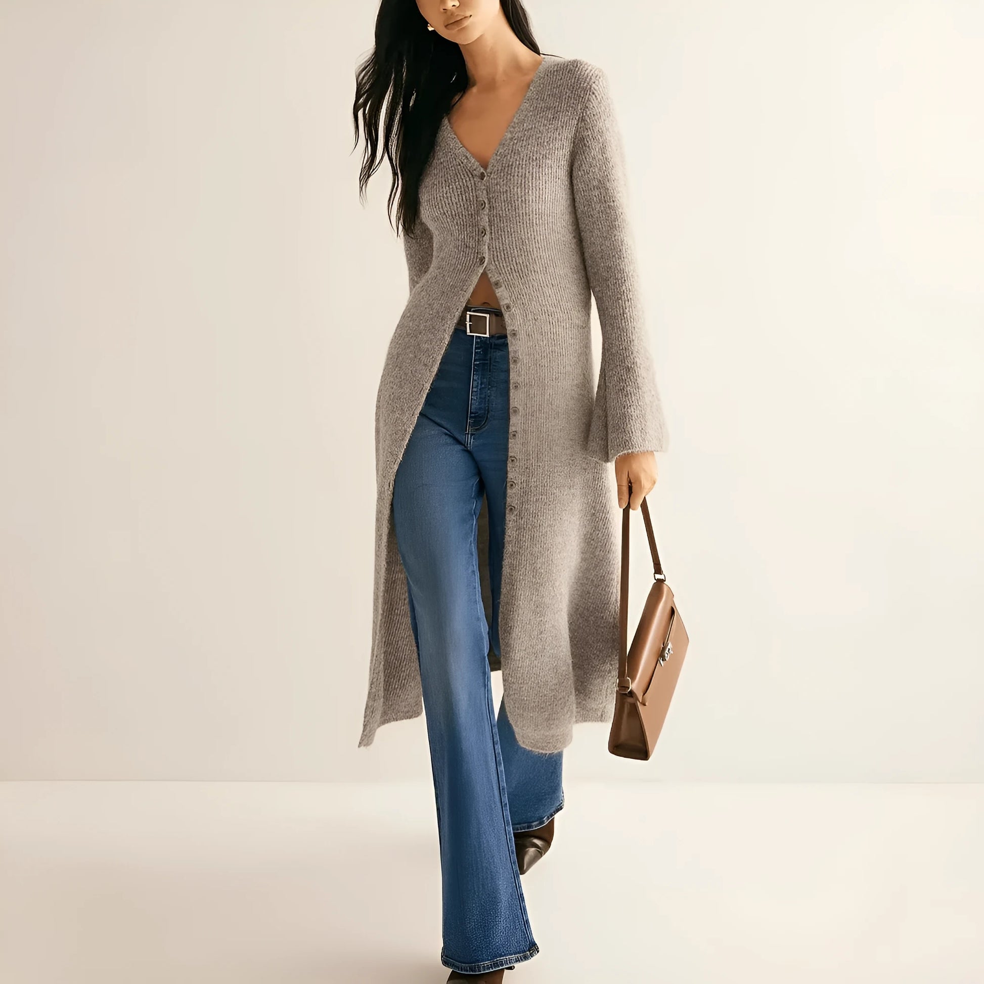 Khaki coloured women's long sleeve button-front cardigan coat on a hanger.