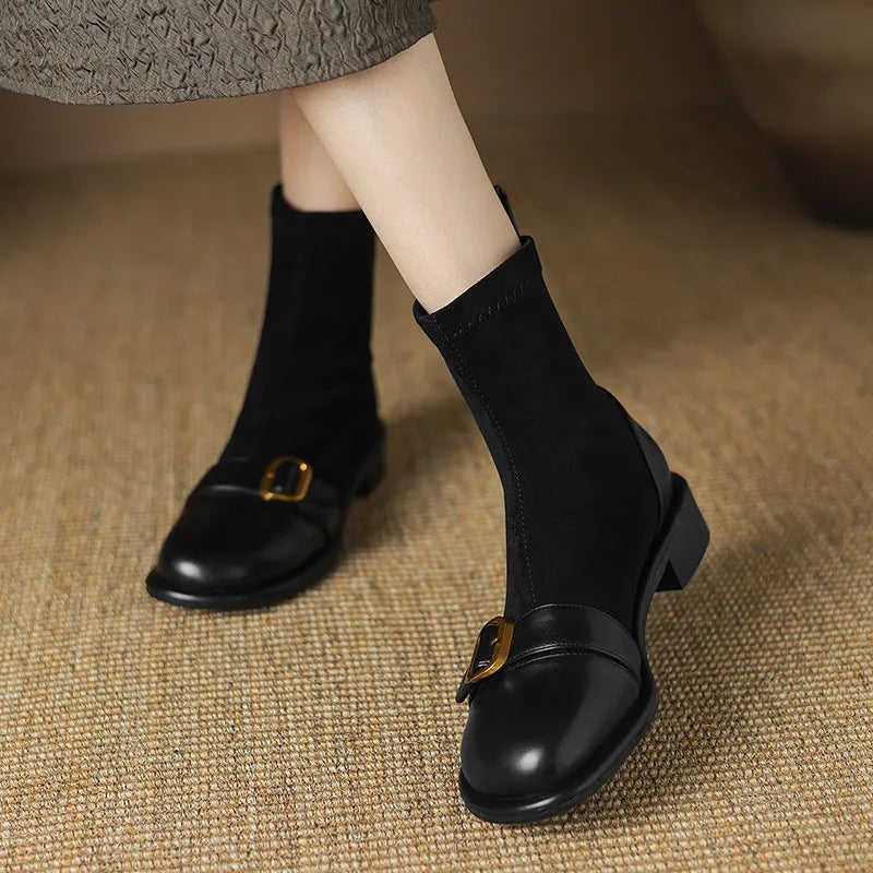 Women's black casual martin boots with low heel, lace-up front, and belt buckle stitching detail