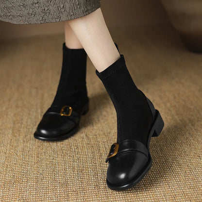 Women's black casual martin boots with low heel, lace-up front, and belt buckle stitching detail