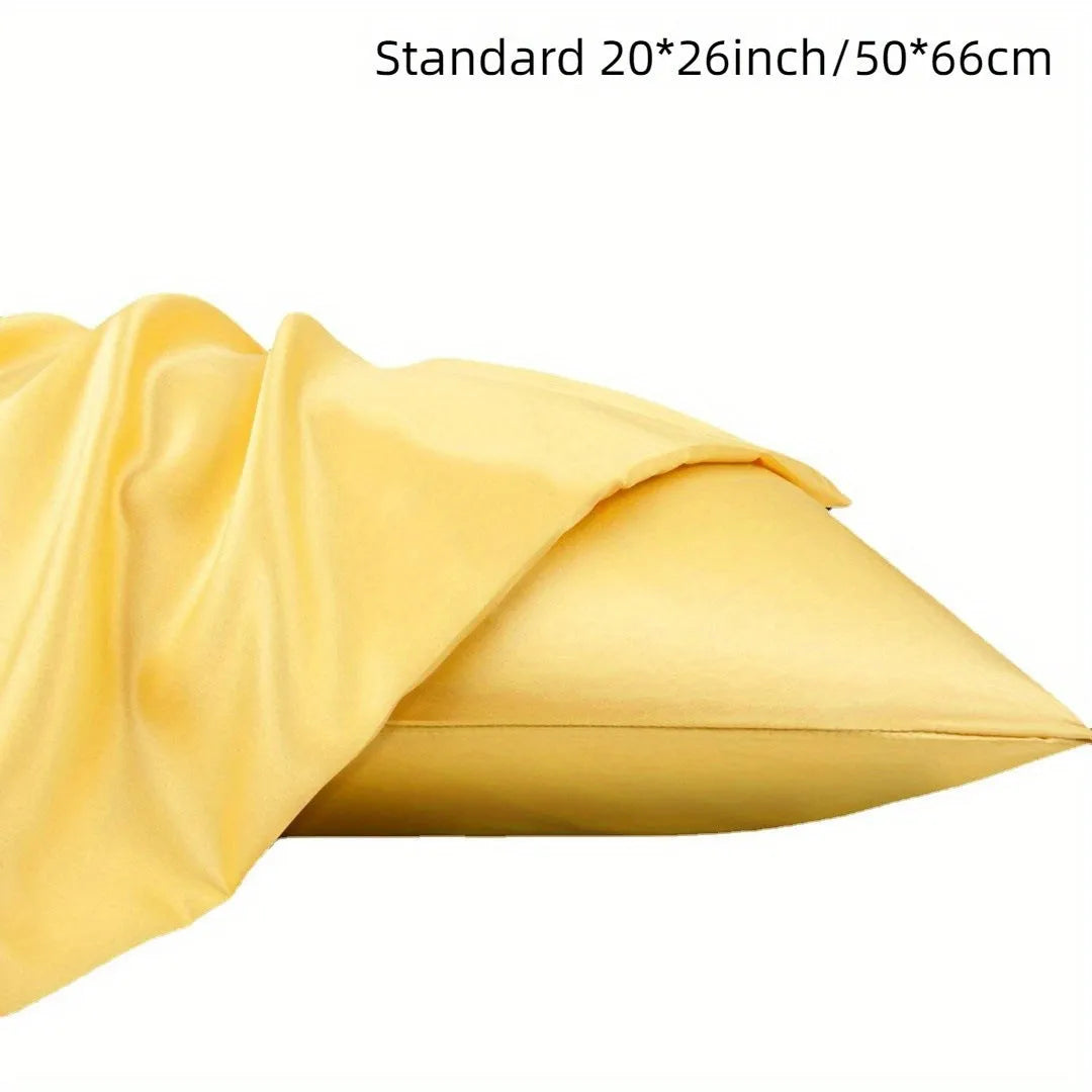 Pair of solid colour satin pillowcases showing smooth plain weave texture and reactive dye colour