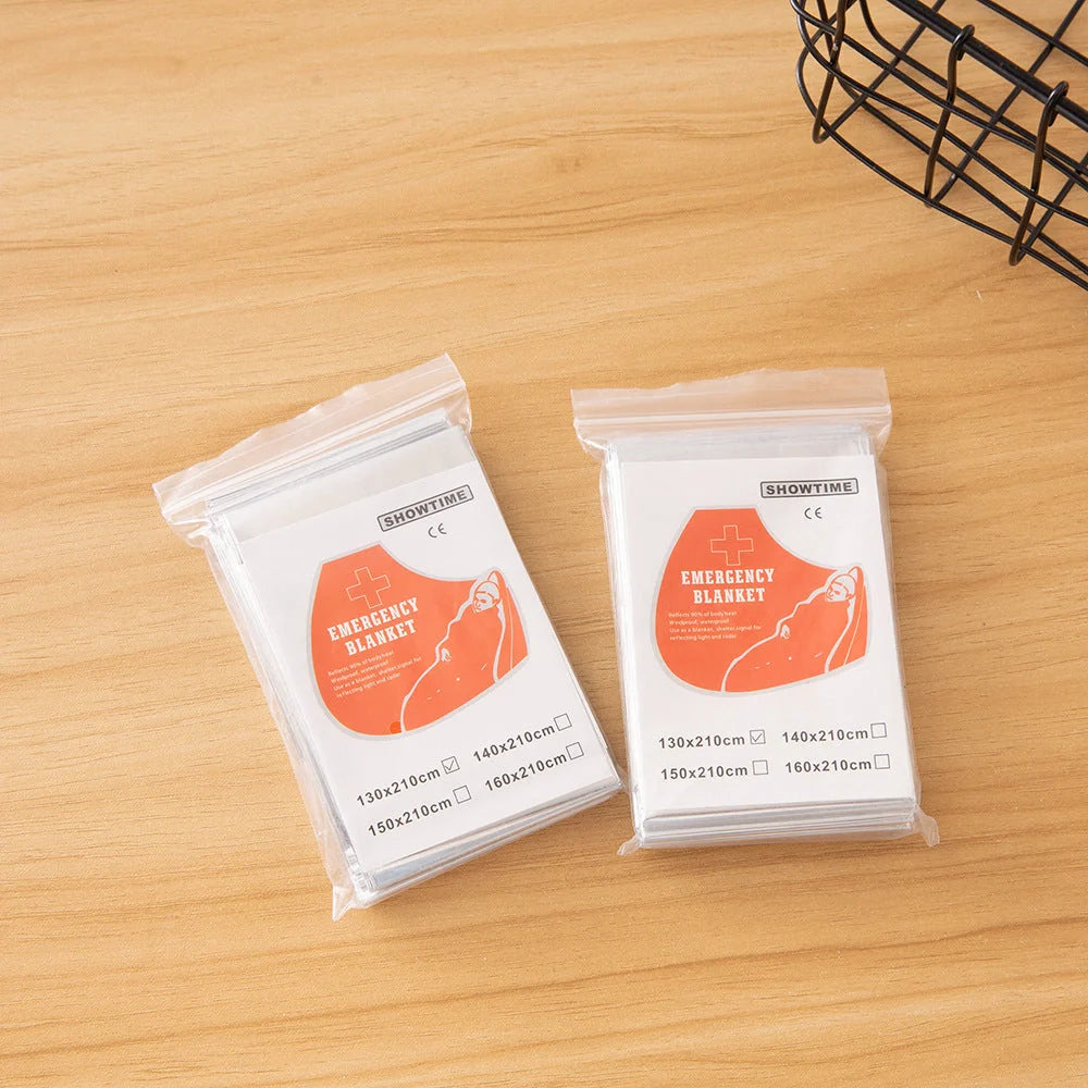 Portable double-sided silver emergency thermal blanket for outdoor adventures and survival situations