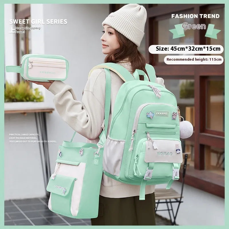 Pink waterproof Oxford cloth school backpack for girls with curved straps on a bookshelf.