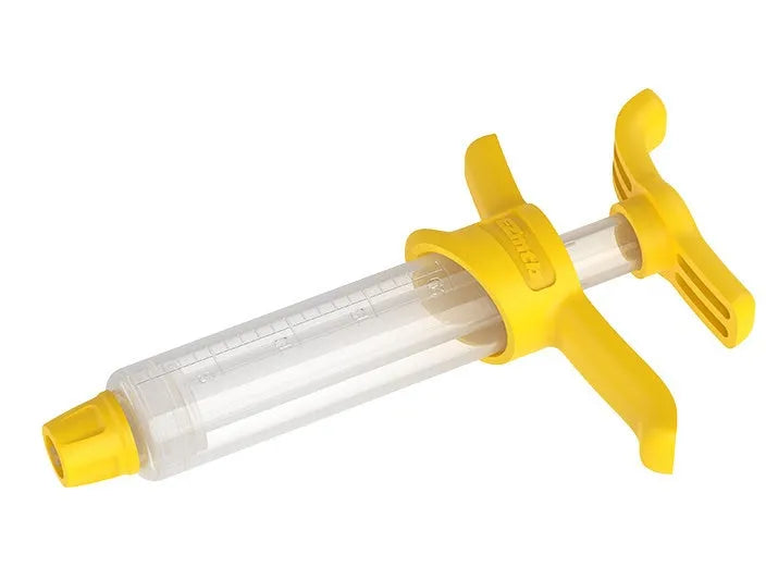 Bicycle hydraulic disc brake oil bleed kit tools with syringes, adapters, and wrenches on a workbench