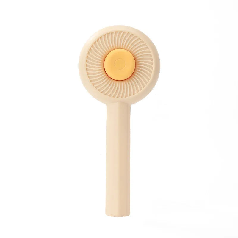 Blue and yellow pet grooming brush with self-cleaning button and angled metal pins for deshedding cats and dogs