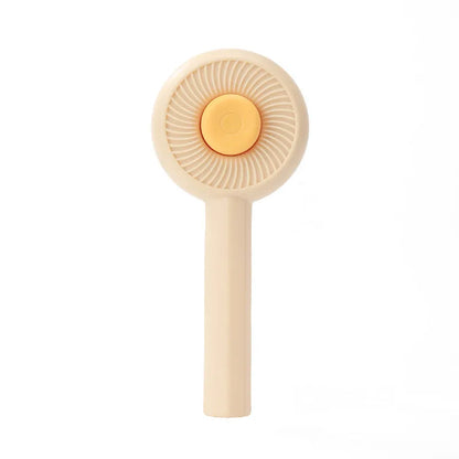 Blue and yellow pet grooming brush with self-cleaning button and angled metal pins for deshedding cats and dogs