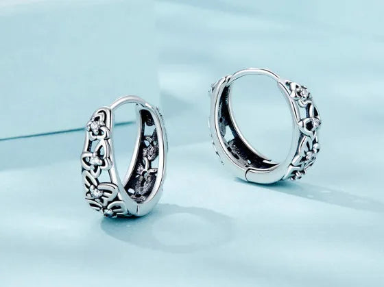 Sterling silver hollow butterfly earrings with zircon accents, retro design measuring 14mm by 5mm