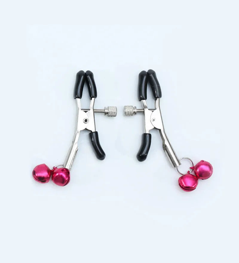Red and purple nipple clamps with small bells and feather decorations for adult sensory play.