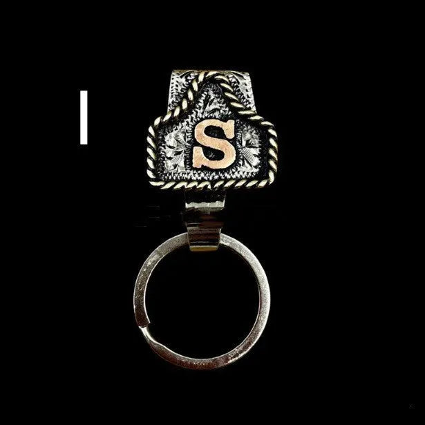 Handmade cow tag design metal keychain on a keyring, shown in one of many available colours.