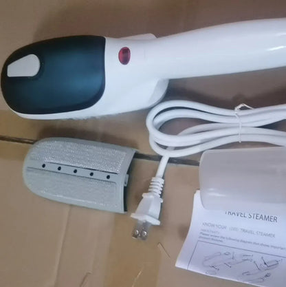 Handheld portable garment steamer with mechanical controls and dual voltage compatibility