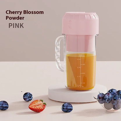 Portable USB-powered juicer in cherry blossom pink or avocado green with 150W motor