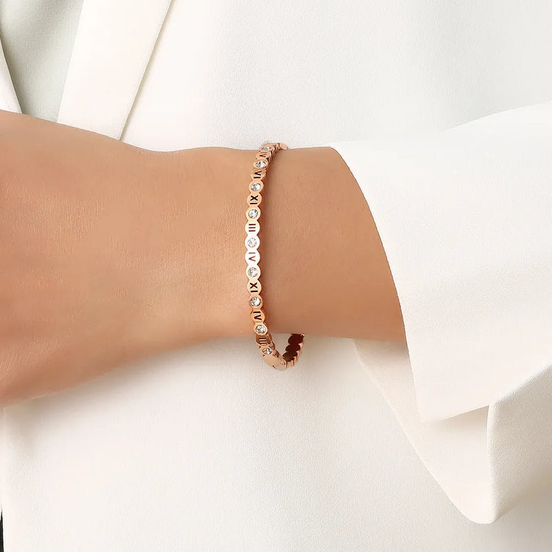 Korean style titanium steel bracelet, electroplated steel, gold, or rose gold colour, featuring a numerical design element, adjustable fit, contemporary unisex accessory.