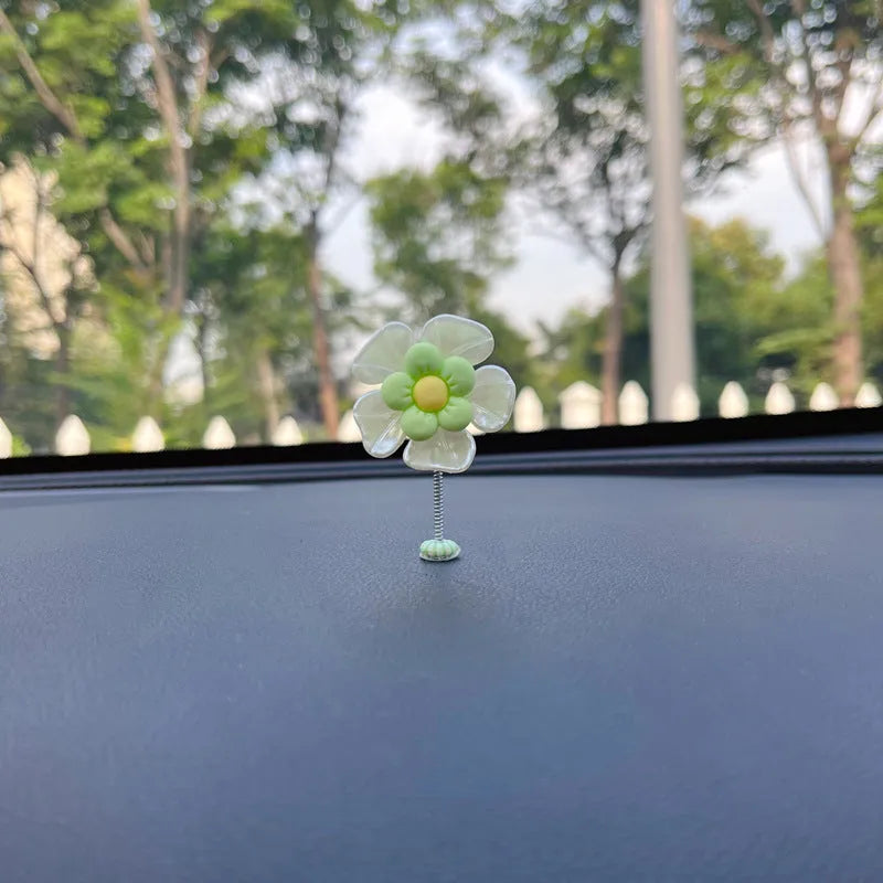 Small plastic car decoration swing measuring 5cm tall in blue, green, pink, purple, and yellow colour options