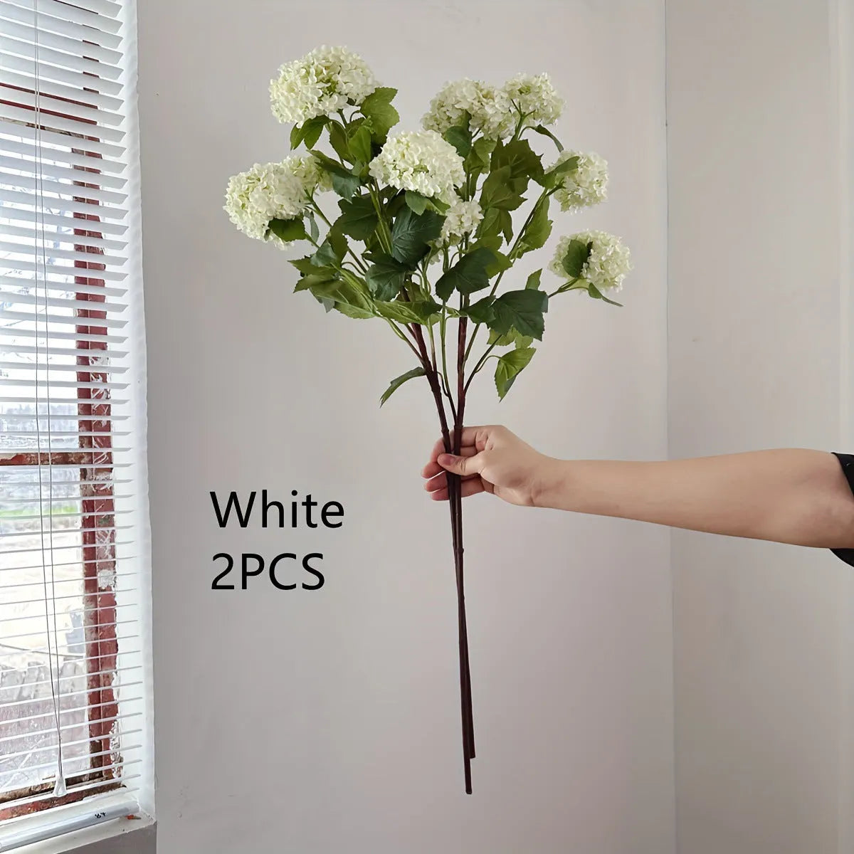 Artificial silk hydrangea flower on long stem branch in white or green colour