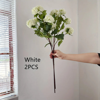 Artificial silk hydrangea flower on long stem branch in white or green colour