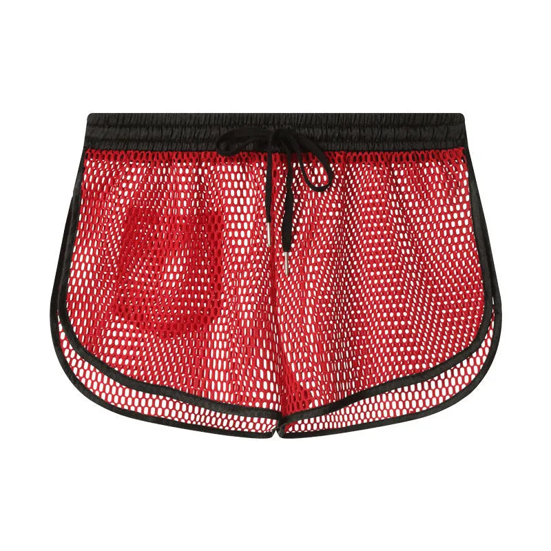 Men's solid colour loose fit polyester boxer shorts shown in black, white, grey, and red.