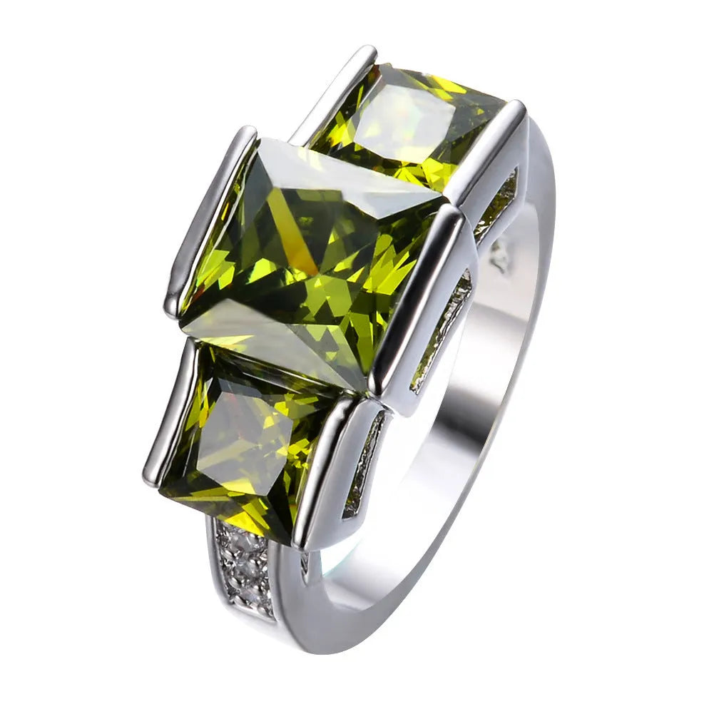 Aier Moxa geometric copper fashion ring in assorted electroplated colours on a plain background.