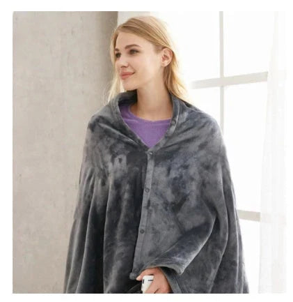 Cozy and heated plush blanket with adjustable temperature settings and soft, plush fabric for maximum winter comfort
