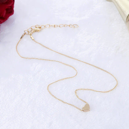 A stylish double-sided love pendant necklace made of premium alloy and featuring a chic geometric design, perfect for elevating any outfit.
