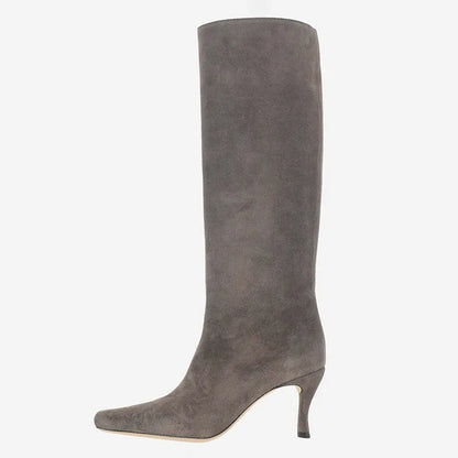 A pair of women's black square-toe cowboy boots made from microfiber leather.