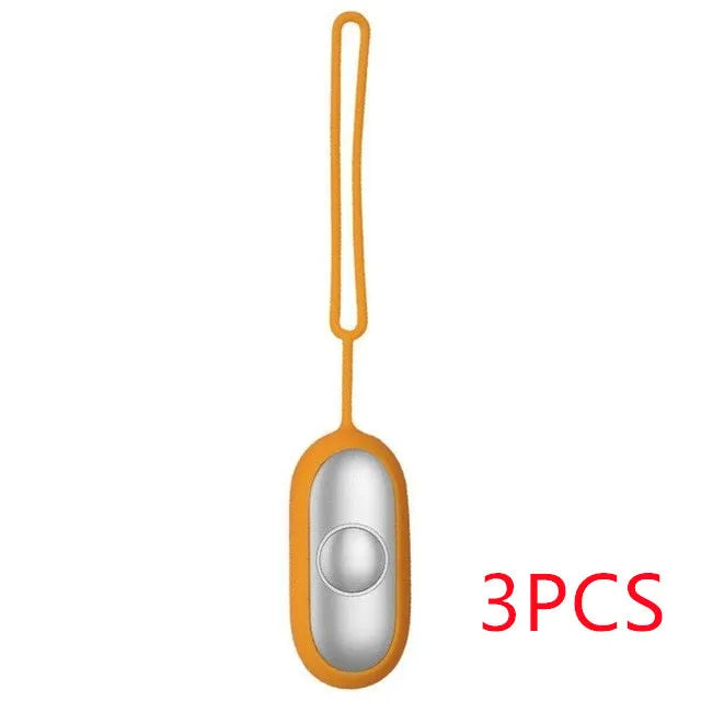 Hand-held micro-current sleep aid device in grey, green, or orange with round button and USB charging port