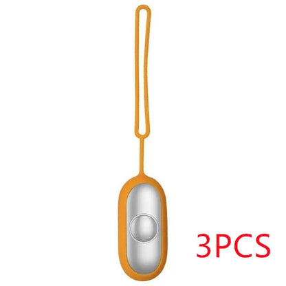 Hand-held micro-current sleep aid device in grey, green, or orange with round button and USB charging port