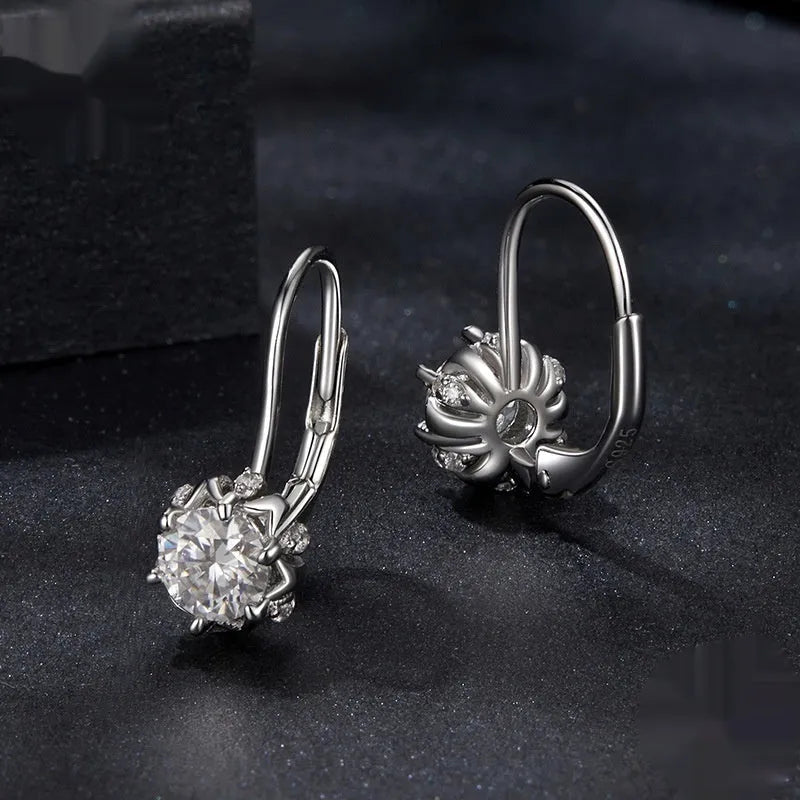 Sterling silver flower bud clip earrings with moissanite and white gold plating