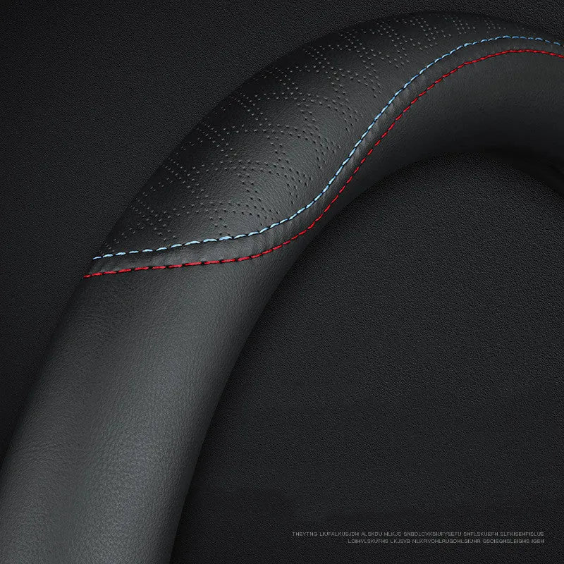 Black universal car steering wheel cover with a Napa leather texture and a two-colour line design, showing a 38cm diameter.