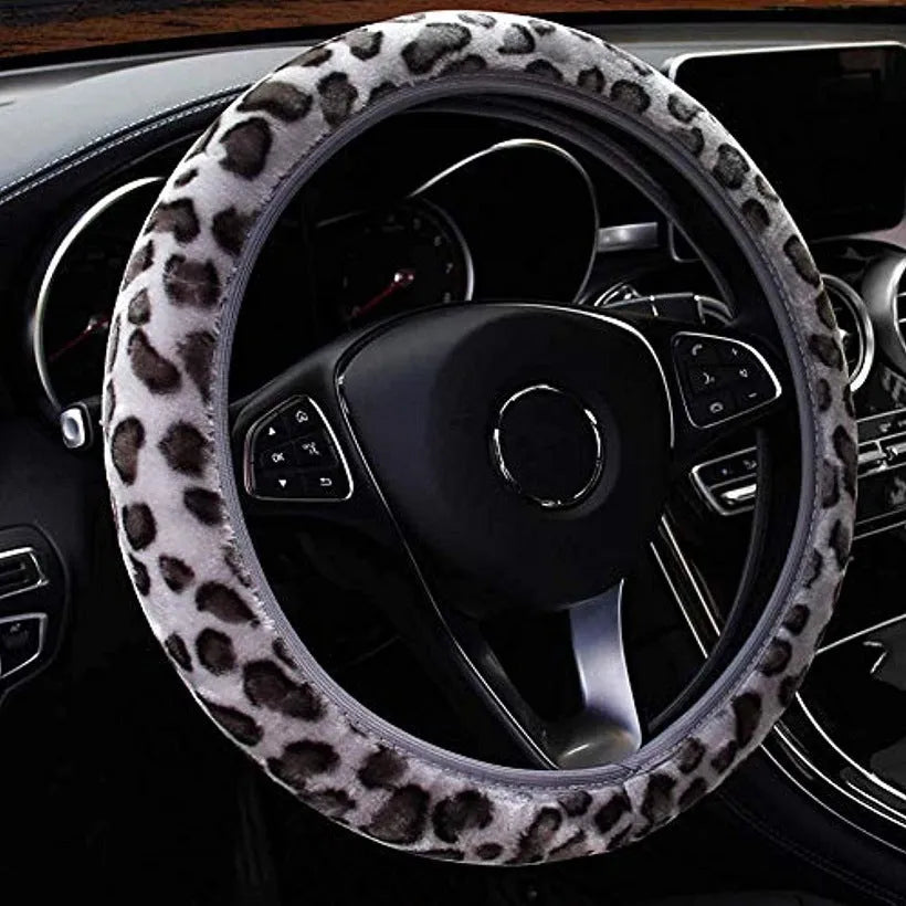 Short plush steering wheel cover in one of seven colours, fitting a 38cm steering wheel with non-slip grip