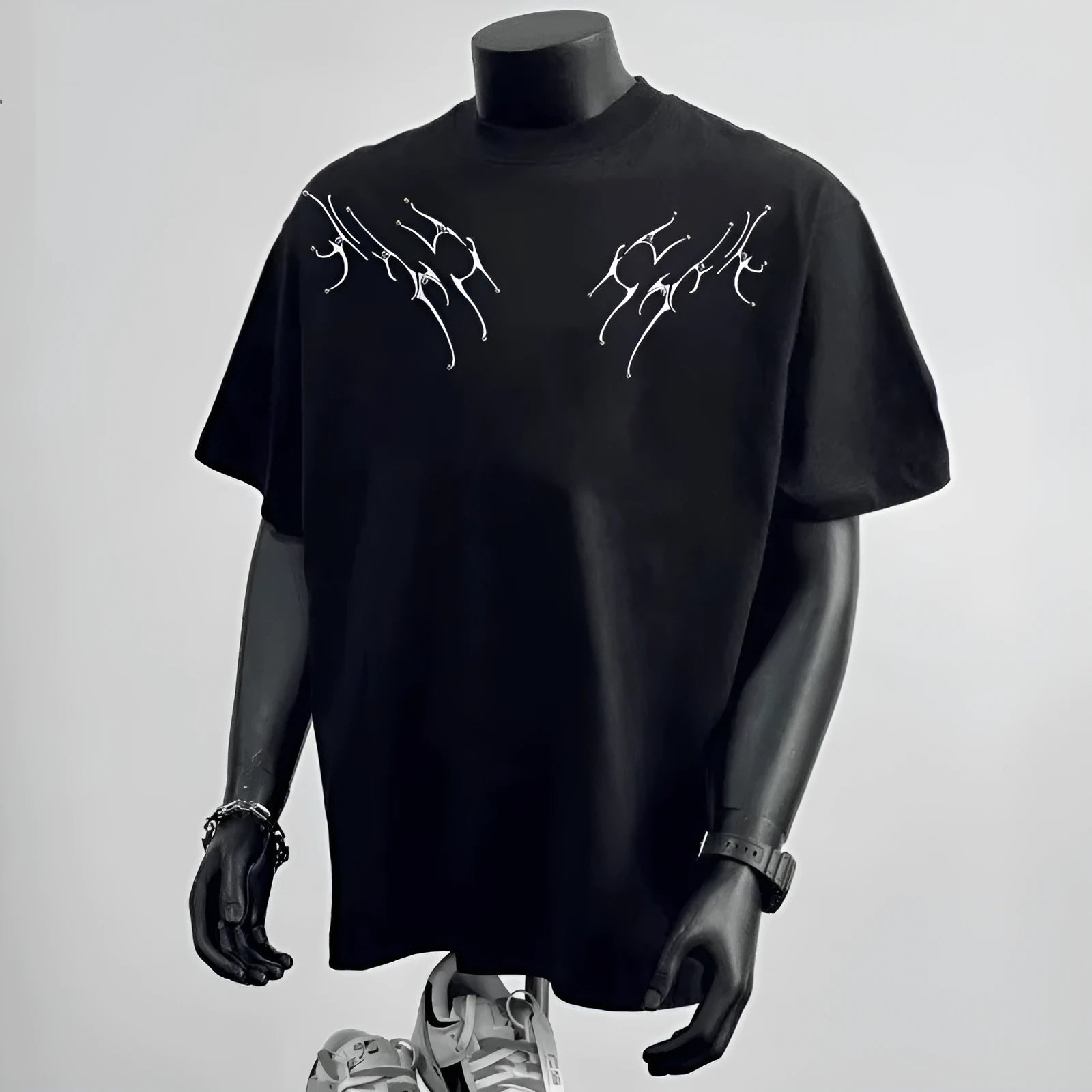 Men's loose fit black cotton short sleeve t-shirt on a hanger.