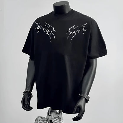 Men's loose fit black cotton short sleeve t-shirt on a hanger.