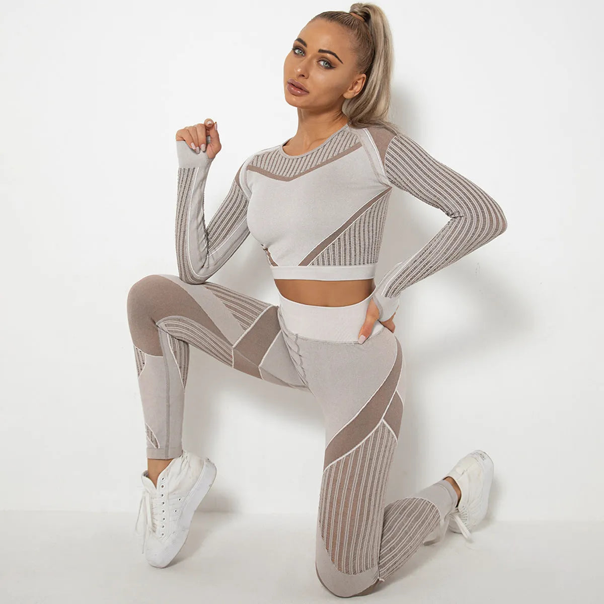 Seamless knitted yoga wearsuit for women in long-sleeved design with stripe pattern
