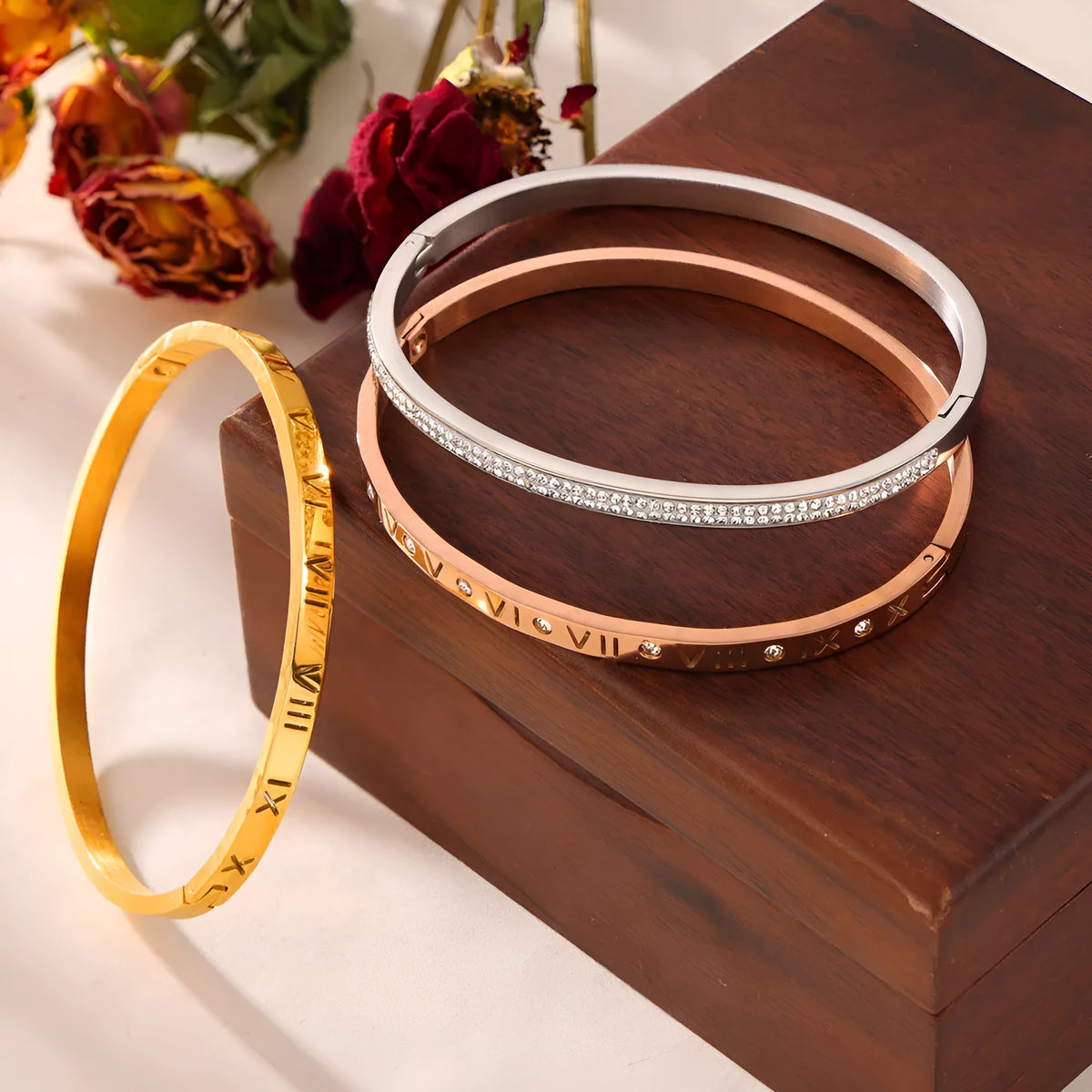 Titanium steel Roman numeral bracelet with gold plated carved design and diamond-embedded detail