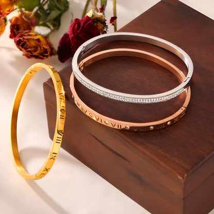 Titanium steel Roman numeral bracelet with gold plated carved design and diamond-embedded detail