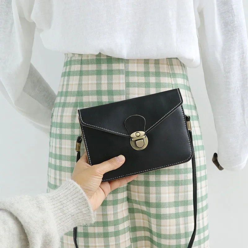 Retro fashion shoulder messenger bag in soft surface material with cross square suitcase shape, featuring internal mobile phone compartment, lock closure detail, and available in wine red, black, and light brown colours for daily matching versatility
