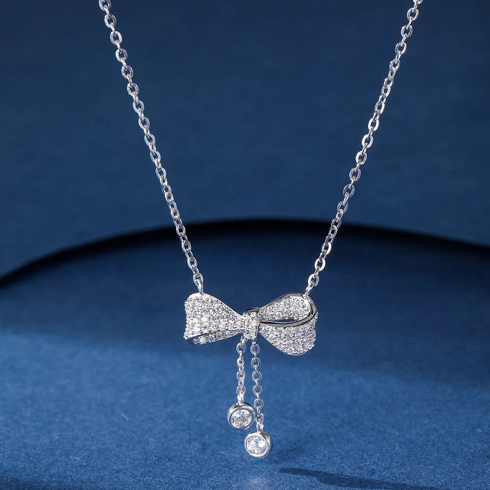 Silver bow pendant necklace with O-ring chain, adjustable 40-45cm length, 925 sterling silver composition