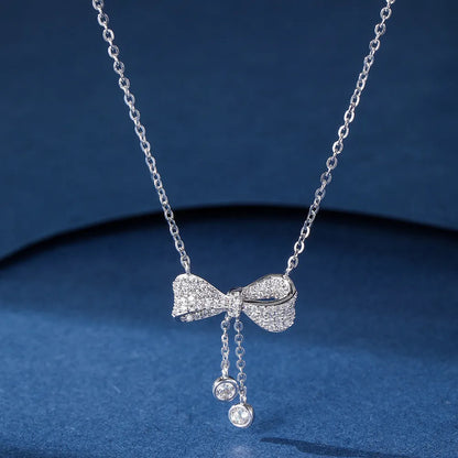 Silver bow pendant necklace with O-ring chain, adjustable 40-45cm length, 925 sterling silver composition