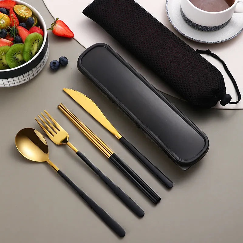 Gold and black stainless steel knife fork spoon set inside a grey mesh carrying bag.