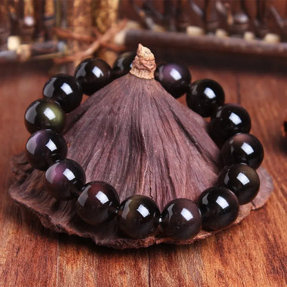 Natural crystal Pi Xiu bracelet with geometric beads on a wrist, showing ice stone colour.