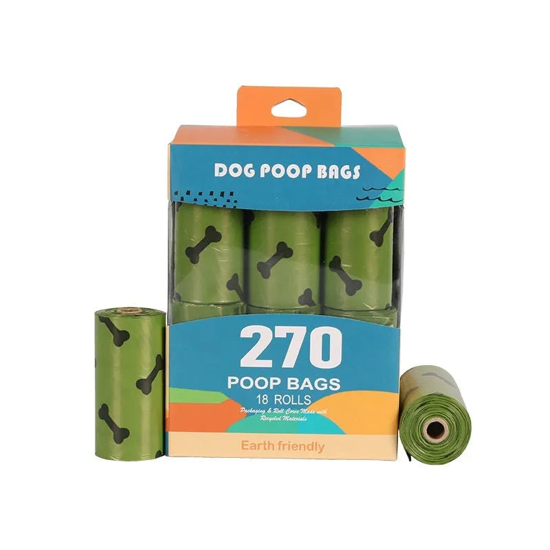 Roll of military green degradable dog poop bags with black bone print, shown next to a plastic dispenser.