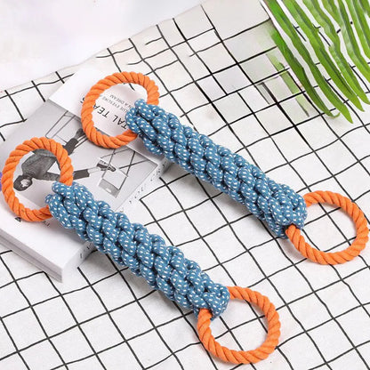 Blue braided bone-shaped cotton rope dog toy with two end rings on a white background.