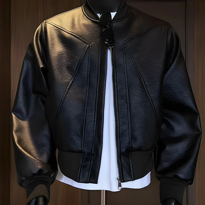 Man wearing a long black PU leather jacket with a litchi grain texture, showing its extended 100cm length and tight fit.