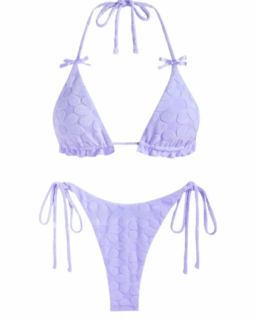 Women's light blue strappy backless bikini swimsuit on a mannequin